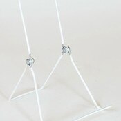 Display easel with wide base hinged to adjust two ways - white