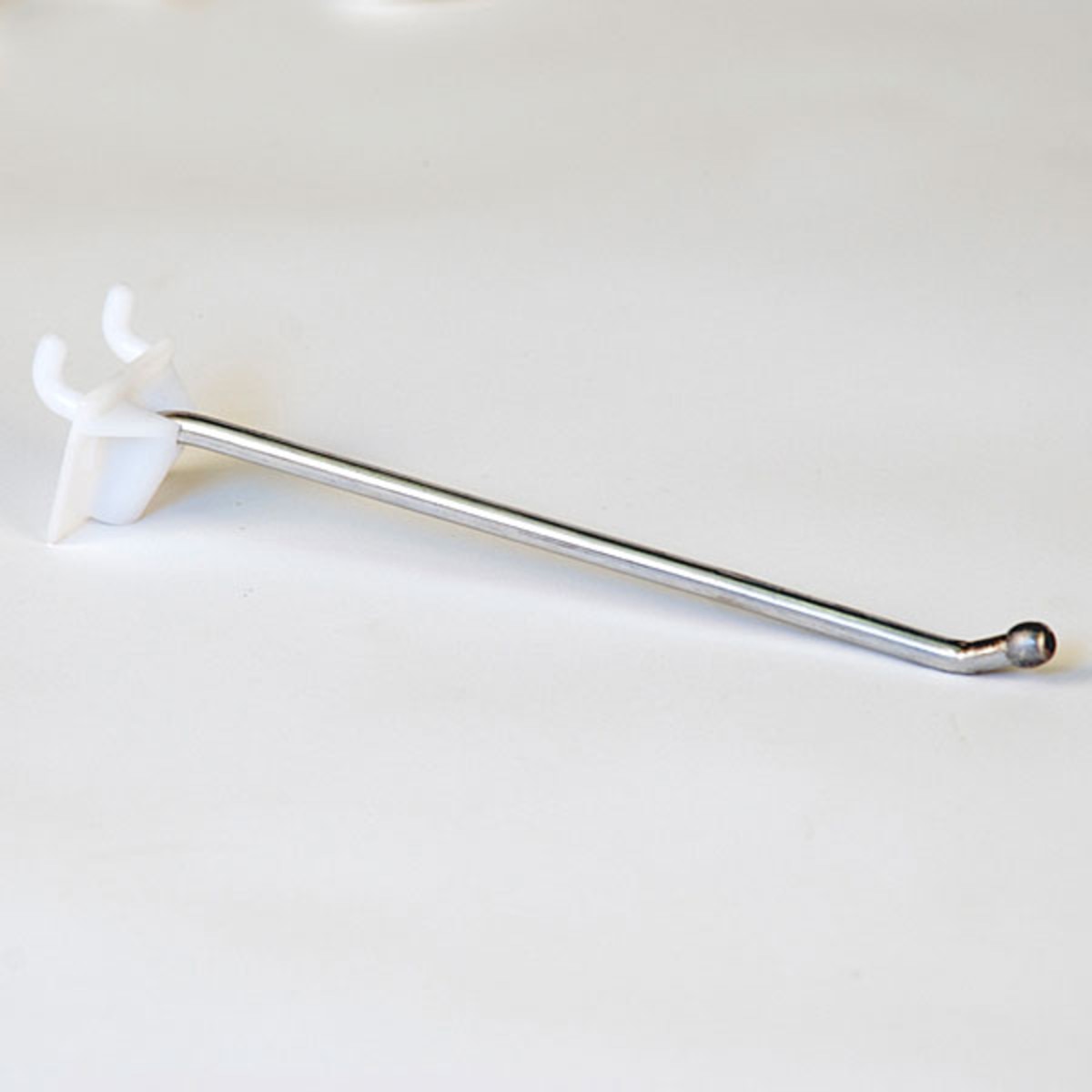 Pegboard hook 6" long - 1/4" wire ball end with plastic back - zinc/white